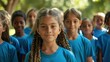 © Natalia - A group of children wearing blue shirts are standing in a park. AI.