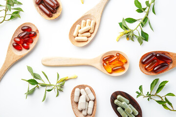 Vitamin capsules in a wooden spoon, soft gels, Fish oil capsules, omega 3, omega 9, vitamin D, vitamin E