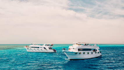 Sticker - two white cruise tourist boats in the Red Sea in Egypt