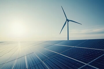 Wind turbine and solar panels under a clear sky.