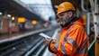 © Sandu - Railway Worker using Tablet at Train Station