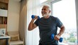 © Reubens Stock Photos - Healthy Lifestyle of Senior Indian Man Exercising with Blue Dumbbells