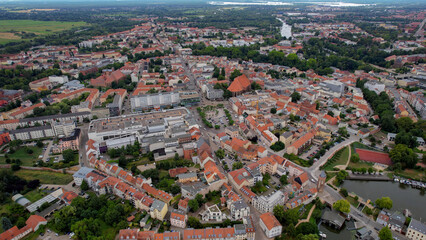 An aerial panorama around the old town of the city Neustadt Brandenburg in Germany on a sunny summer day.	