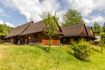 Canvas Print - Wooden village houses in the open air museum (Valasske muzeum v prirode) in Roznov pod Radhostem, Czechia