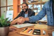 © alisaaa - Consultant / Agent and clients on a handshake at business meeting Win Win Agreement
