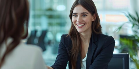 portrait of two business women making a deal business concept