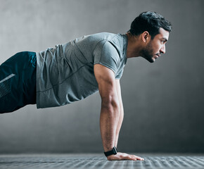 Poster - Man, power and push up in gym for fitness, strong muscle development and intensity workout. Male person, profile and confident in exercise routine at health club, training challenge and bodybuilder