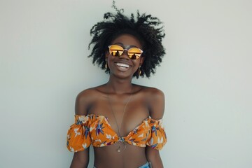 Wall Mural - A woman wearing a bikini top and sunglasses