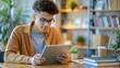 © Htet Wai Phyo - essentials of good study habits,  A student utilizing a laptop or tablet for research, integrating technology into effective study habits.