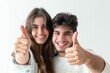 © Fotograf - A happy couple giving a thumbs up in a joyful moment, great for use in social media, advertising, or personal projects