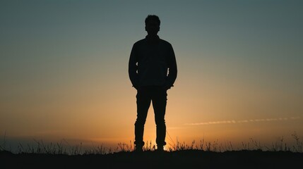 The silhouette of Asian man standing.