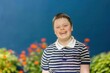 © alisaaa - Smiling From Ear to Ear A teenage Down syndrome boy looking at the camera, smiling and looking happy.