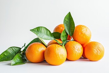 Wall Mural - A cluster of fresh oranges with green leaves on a white background.