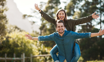 Poster - Portrait, happy and couple with piggyback outdoor for summer freedom, marriage love and anniversary date. Smile, man and woman playful for vacation travel, flying trust and bonding together in nature