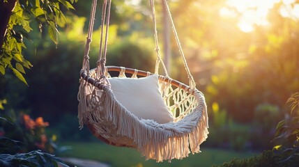 Wall Mural - Macrame swing chair with fringe details, in front of a sunlit garden backdrop