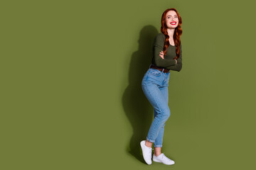 Wall Mural - Full length photo of adorable pretty lady wear shirt arms crossed looking empty space isolated khaki color background