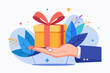 © Ouahdou - Gift reward program, bonus or surprise present for customer, employee reward or lucky prize, birthday gift box or festive incentive, special loyalty program concept, hand giving gift box with ribbon.