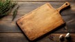 © Elshad Karimov - Homemade pizza cutting board for cooking or baking on a wooden tabletop. Empty pizza board ready to be used. Bakery concept in the kitchen.