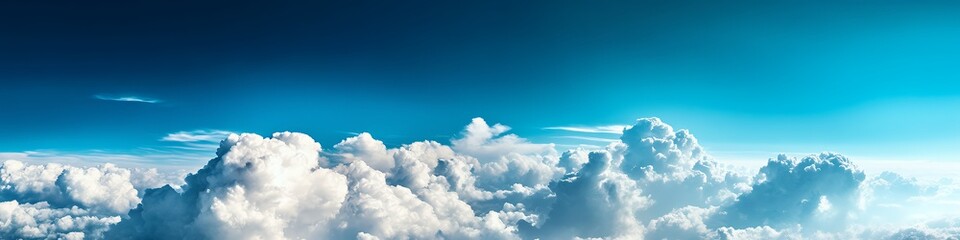 Wall Mural - A serene sky filled with fluffy clouds against a gradient blue backdrop.