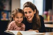 © Rawpixel.com - Teacher assisting her Latina student reading school child.