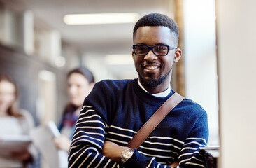 Wall Mural - Portrait, hallway and man with backpack, knowledge and proud of scholarship for college or learning. Corridor, university student and smile for education, arms crossed and person in campus or glasses