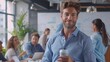 © LukaszDesign - Confident businessman smiling in a boardroom while using his cellphone. A diverse team collaborates in the background, with a manager overseeing as he browses the internet and enjoys coffee