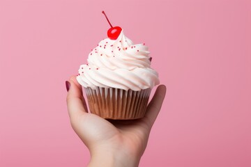 Sticker - Hand holding a cupcake dessert cream food.