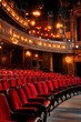 © M - Elegant red velvet seats in an ornate theater illuminated by vintage lighting, showcasing the ambiance of a classic performance venue