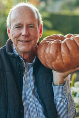 Portrait, pumpkin and thanksgiving with old man outdoor in garden for celebration or festive event. Face, happy and vegetable with senior person in USA for July holiday or tradition in autumn season