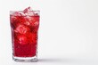 © dima040293 - Chilled red drink with ice in a clear glass on a white background