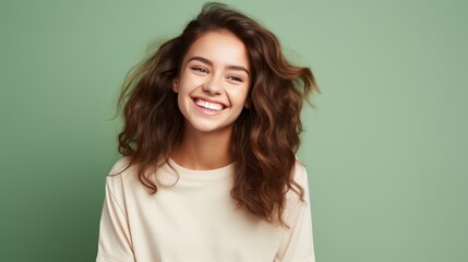 Portrait of a cheerful teenage girl with a bright smile, wearing casual clothes 