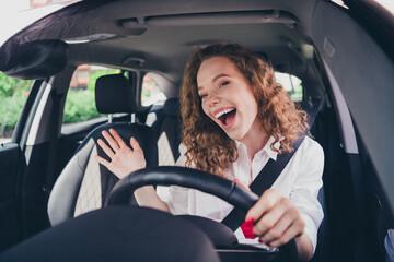 Poster - Photo of cheerful pretty lady dressed white shirt singing driving automobile enjoy traffic outdoors urban city street