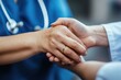 © miss irine - Nurse gently holds hands with patient in nursing home setting. Medical professional provides support and care. Kindness and empathy are shown through touch.