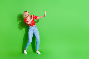 Poster - Photo of crazy excited girl hands fighting empty space isolated green color background