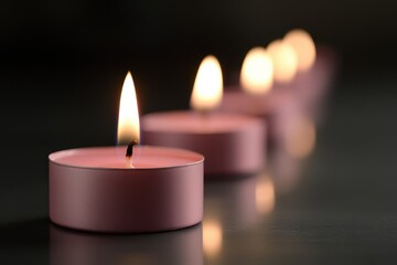 Pink Candle Vigil: A serene image of several pink candles burning in a row, with soft, warm light casting gentle shadows. The candles should be arranged on a reflective surface, and the flames should 