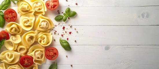 Poster - Tortellini and vegetables on a white wooden surface. Copy space image. Place for adding text and design