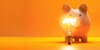 © miss irine - Piggy bank with glowing lightbulb on bright yellow orange background offers plenty of copy space for creative expression. Simple design emphasizes saving energy concept.