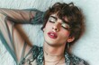 © miss irine - Young transgender man wears makeup, woman clothes, posing confidently. Fashionable, glamorous, androgynous appearance. Man with feminine features, attractive face, lipstick, and makeup.