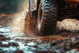 Off road vehicle coming out of a mud hole hazard, mud and water splash in off-road racing
