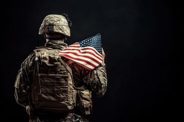 Soldier Holding American Flag in the Dark