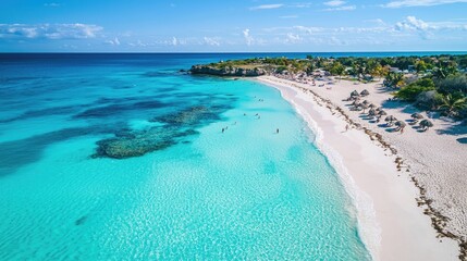 Wall Mural - An overhead shot of a beautiful beach with clear turquoise waters and white sand.