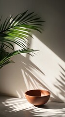 Poster - Empty terracotta bowl casting shadow on white table with palm tree