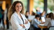 © Zaleman - An empathetic doctor nurse portrait shot smiling cheerfully and confidently in the front row of a medical training class or seminar room, Stock