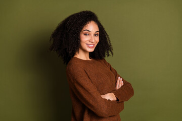 Poster - Photo of nice young woman crossed arms empty space wear pullover isolated on khaki color background