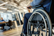 © pilipphoto - Disabled person in wheelchair in an office environment