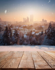 Wall Mural - Empty wooden table top on blurred winter city background. For product display