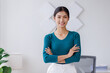 © David - Portrait of young Asain business woman standing with confidence expression arms crossed and looking at the camera in the office.