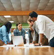 © SensSai/peopleimages.com - Library, college student and smile with laptop for assignment for research, teamwork and collaboration. People, classmates and university learner with documents or online for theory and notes