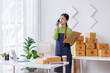 © David - Startup SME small business entrepreneur SME or freelance Asian woman calling phone, online marketing packaging box and delivery, SME concept