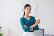 © David - Young successful employee business asian woman in blue shirt work hold takeaway delivery craft paper cup coffee to go stand at desk with laptop pc computer at office.